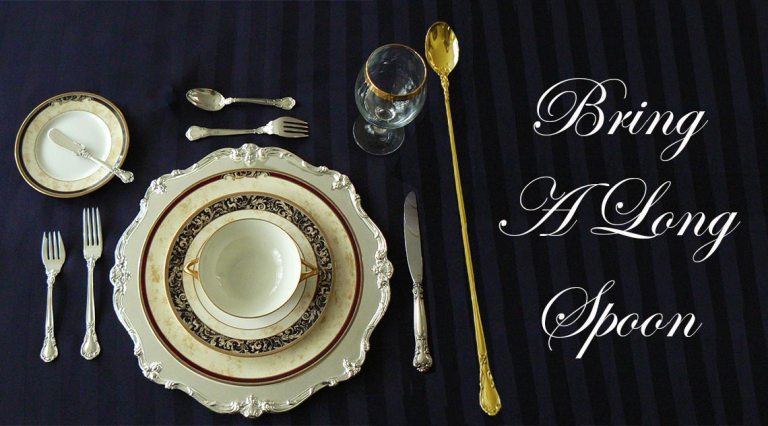 Table setting with long gold spoon